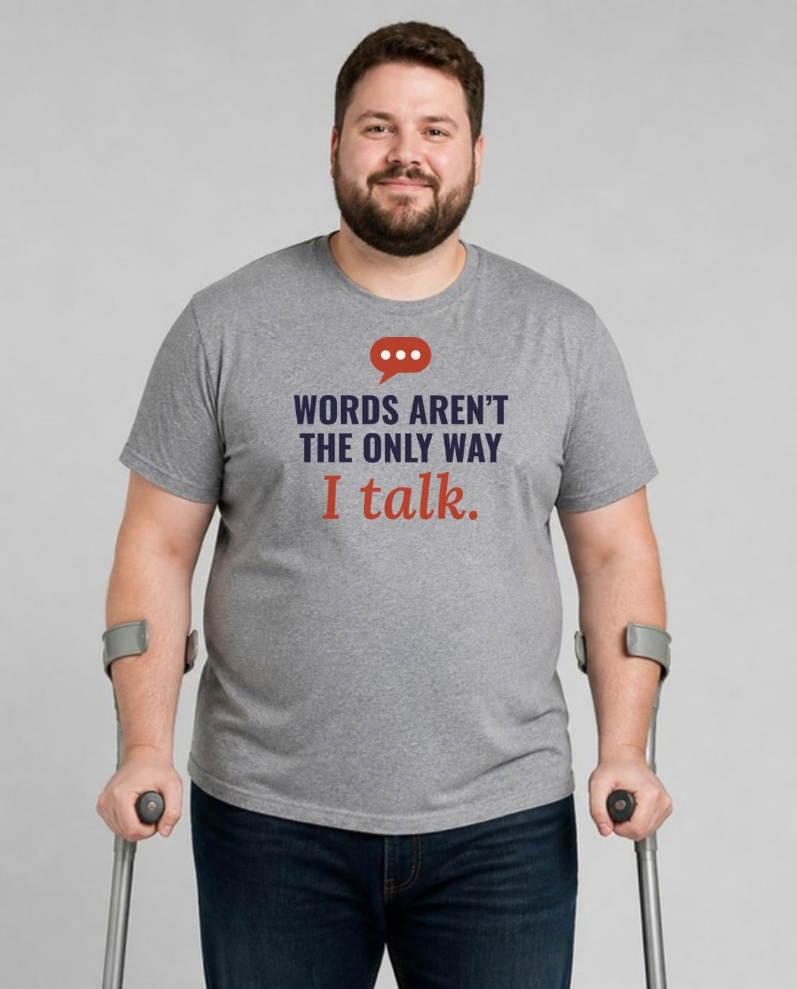 Man who uses forearm crutches wearing the Words Aren’t the Only Way I Talk Adult Tee in Athletic Heather