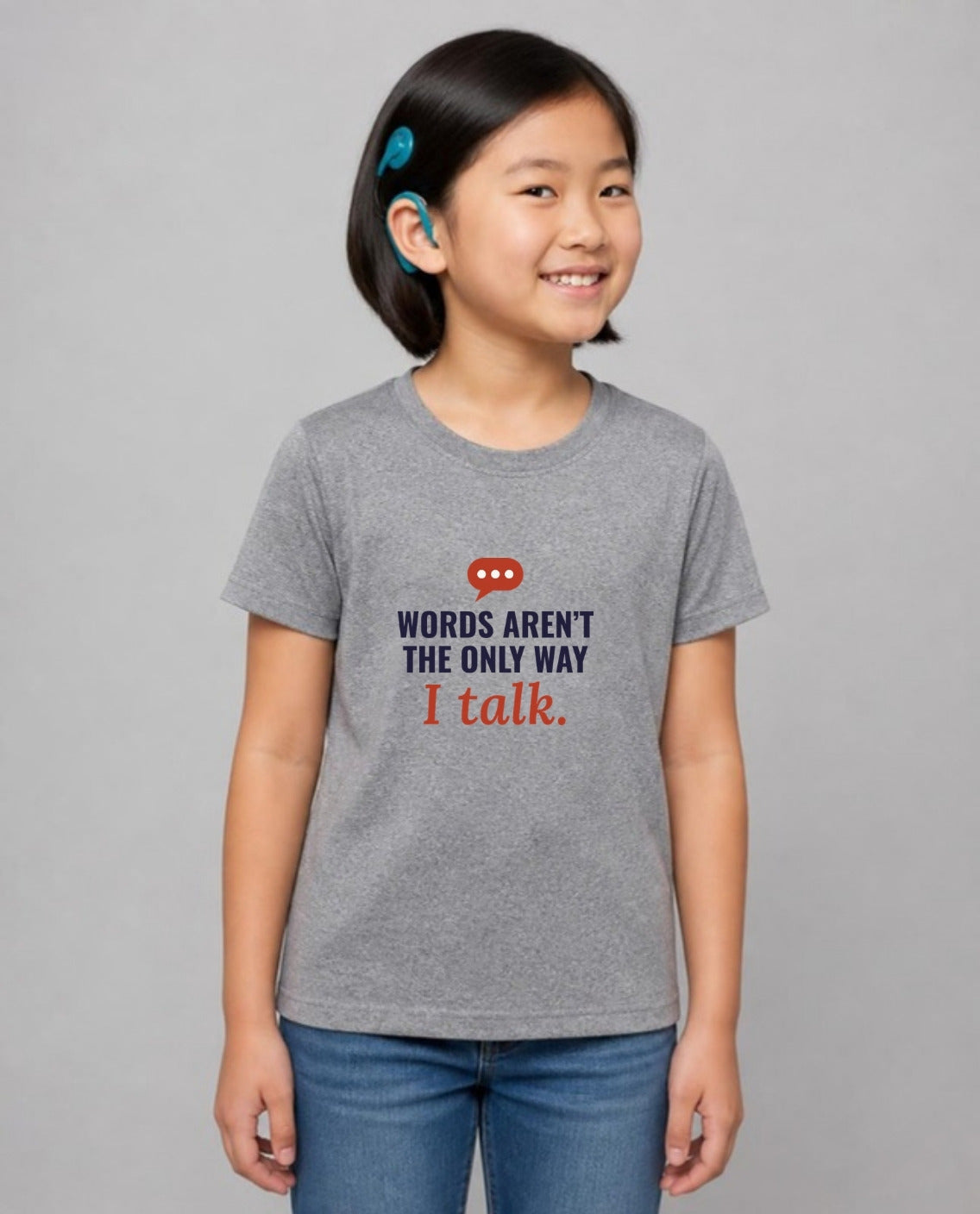 Girl with a cochlear implant wearing the Words Aren’t the Only Way I Talk Youth Tee in Athletic Heather