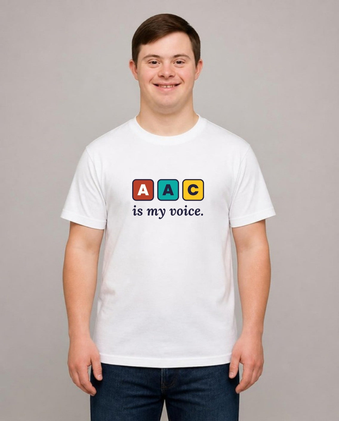Young man with Down syndrome wearing the AAC Is My Voice Adult Tee in White