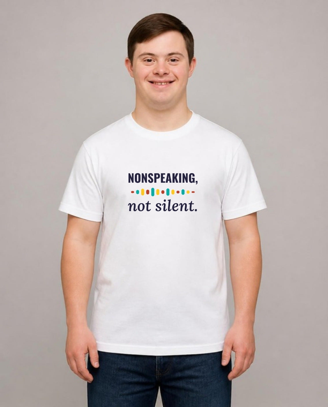 Young man with Down syndrome wearing the Nonspeaking, Not Silent Adult Tee in White