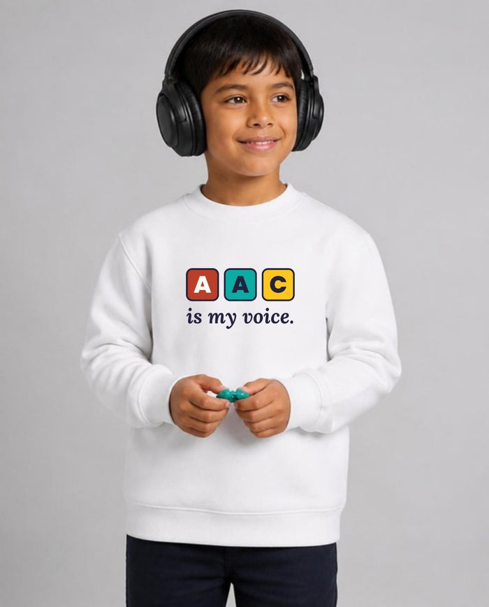 Autistic boy in noise-canceling headphones wearing the AAC Is My Voice Youth Sweatshirt in White