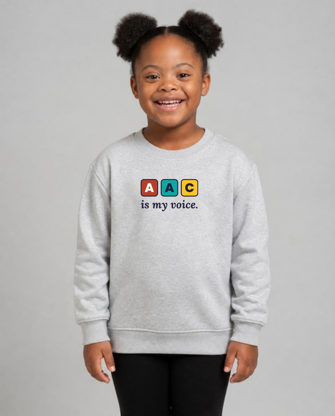 Girl with Down syndrome wearing the AAC Is My Voice Youth Sweatshirt in Sport Grey
