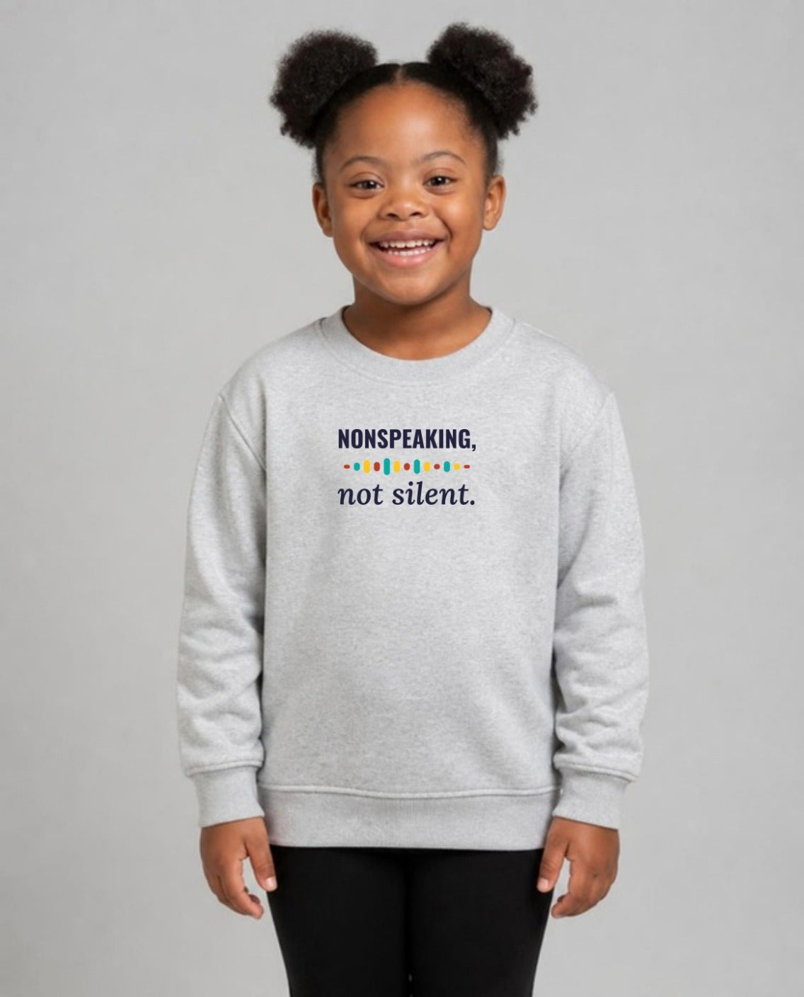 Girl with Down syndrome wearing the Nonspeaking, Not Silent Youth Sweatshirt in Sport Grey