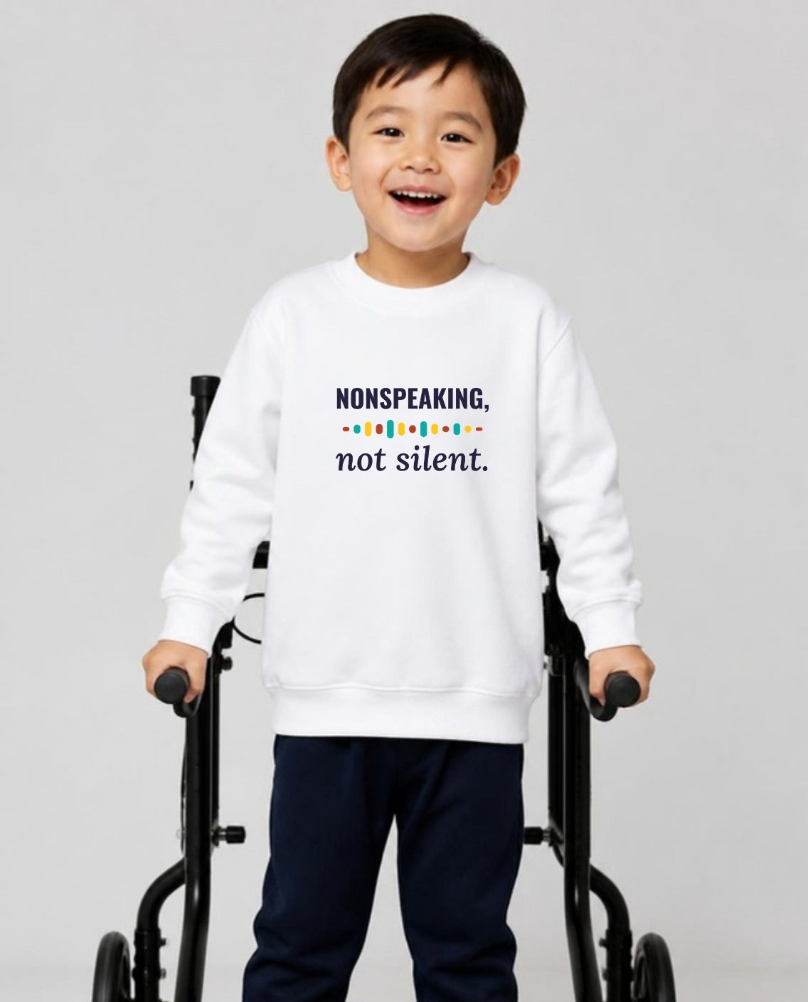 Boy who uses a walker wearing the Nonspeaking, Not Silent Youth Sweatshirt in White