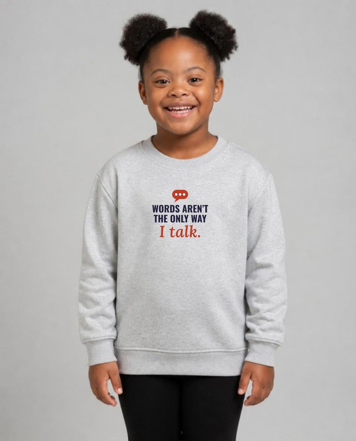 Girl with Down syndrome wearing the Words Aren’t the Only Way I Talk Youth Sweatshirt in Sport Grey