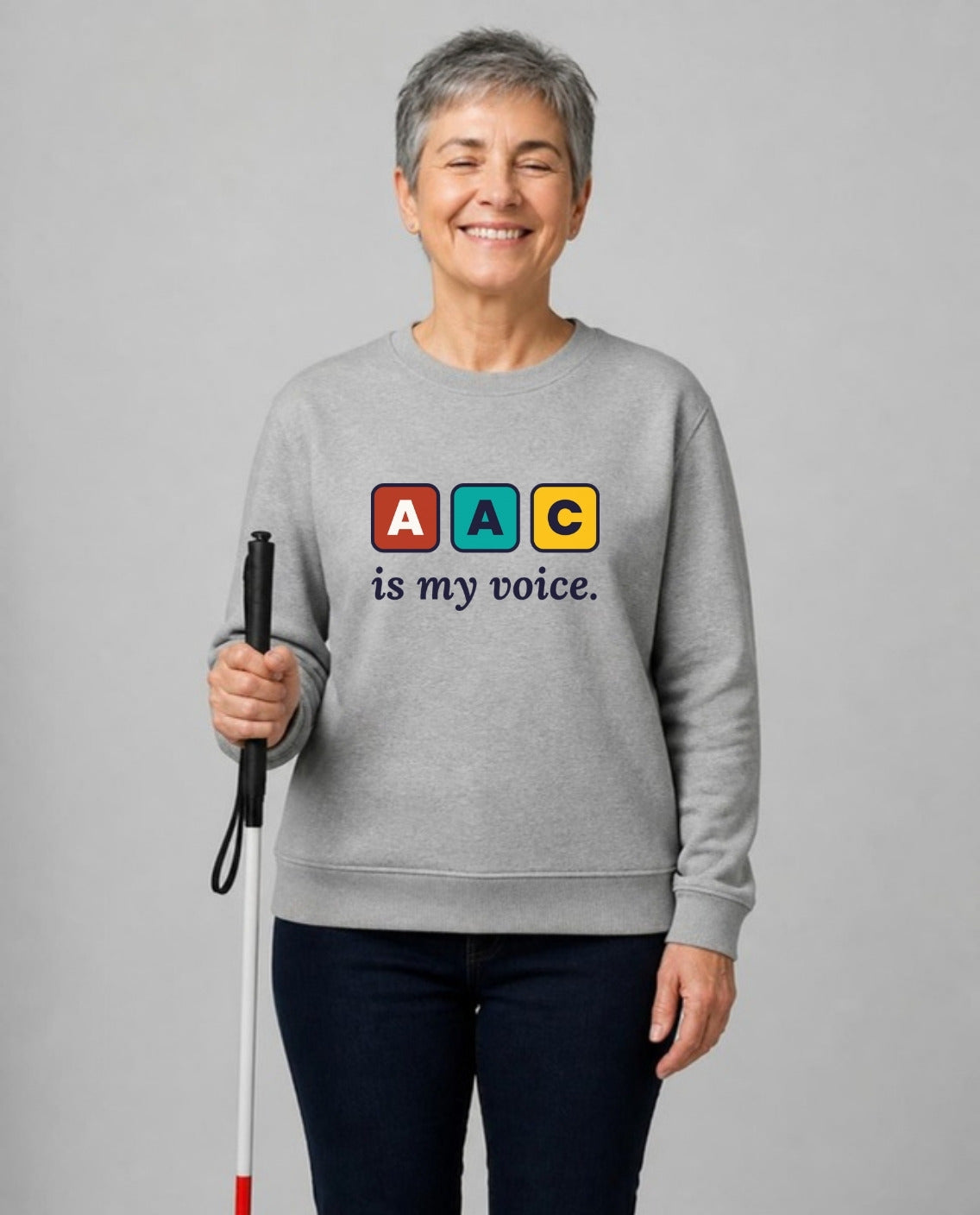 Blind woman with a white cane wearing the AAC Is My Voice Adult Sweatshirt in Sport Grey