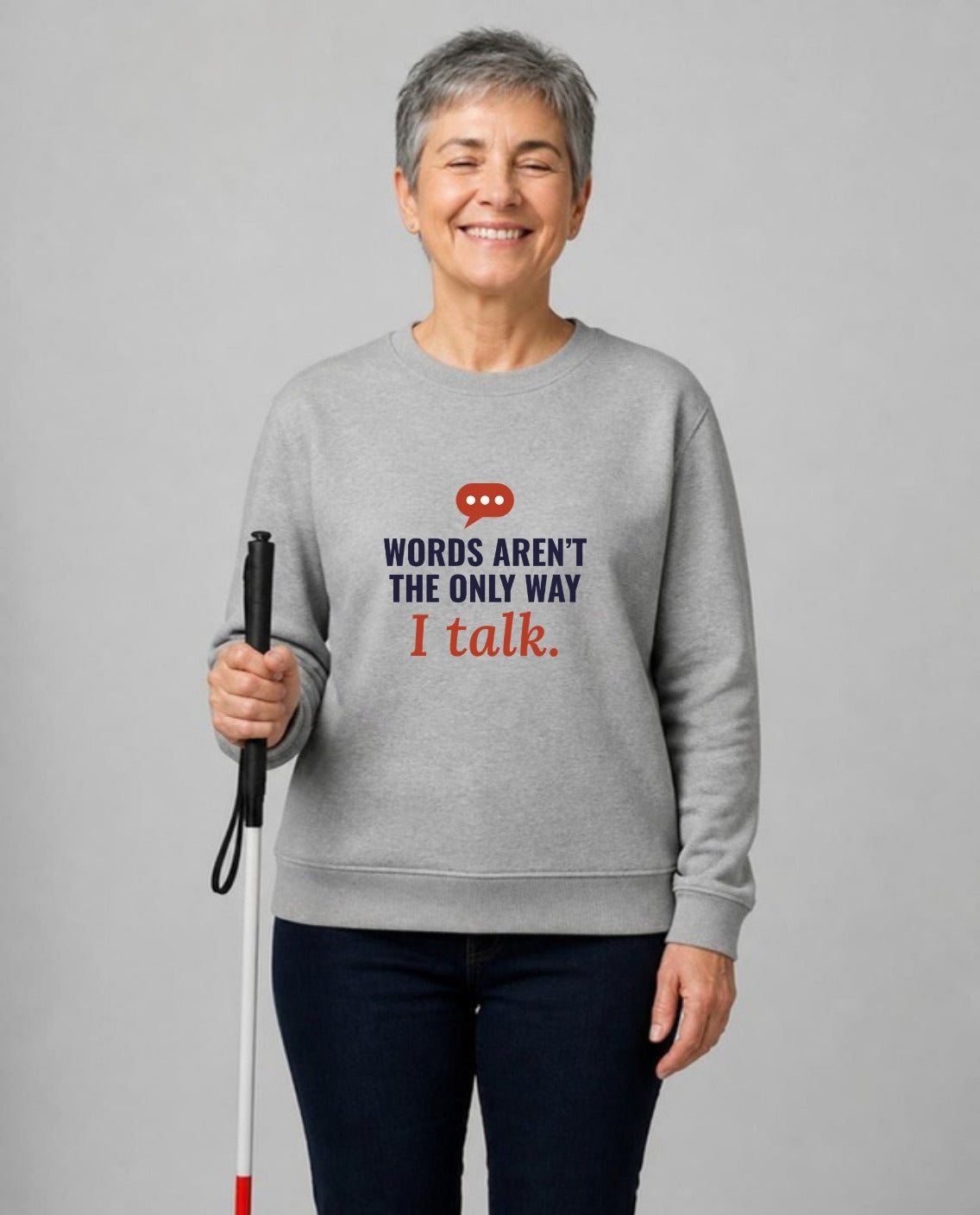 Blind woman with a white cane wearing the Words Aren’t the Only Way I Talk Adult Sweatshirt in Sport Grey