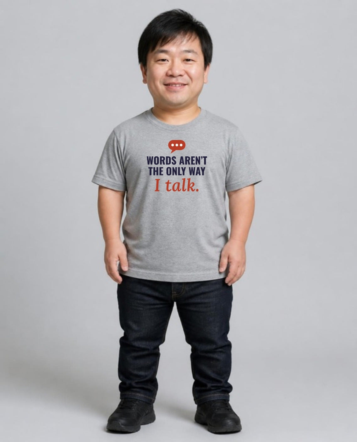 Man with achondroplasia wearing the Words Aren’t the Only Way I Talk Adult Tee in Athletic Heather
