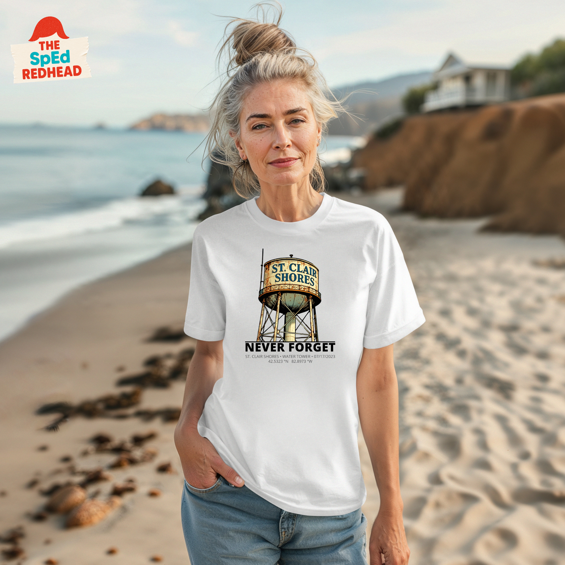 Woman wearing a white t-shirt with a graphic design on a beach