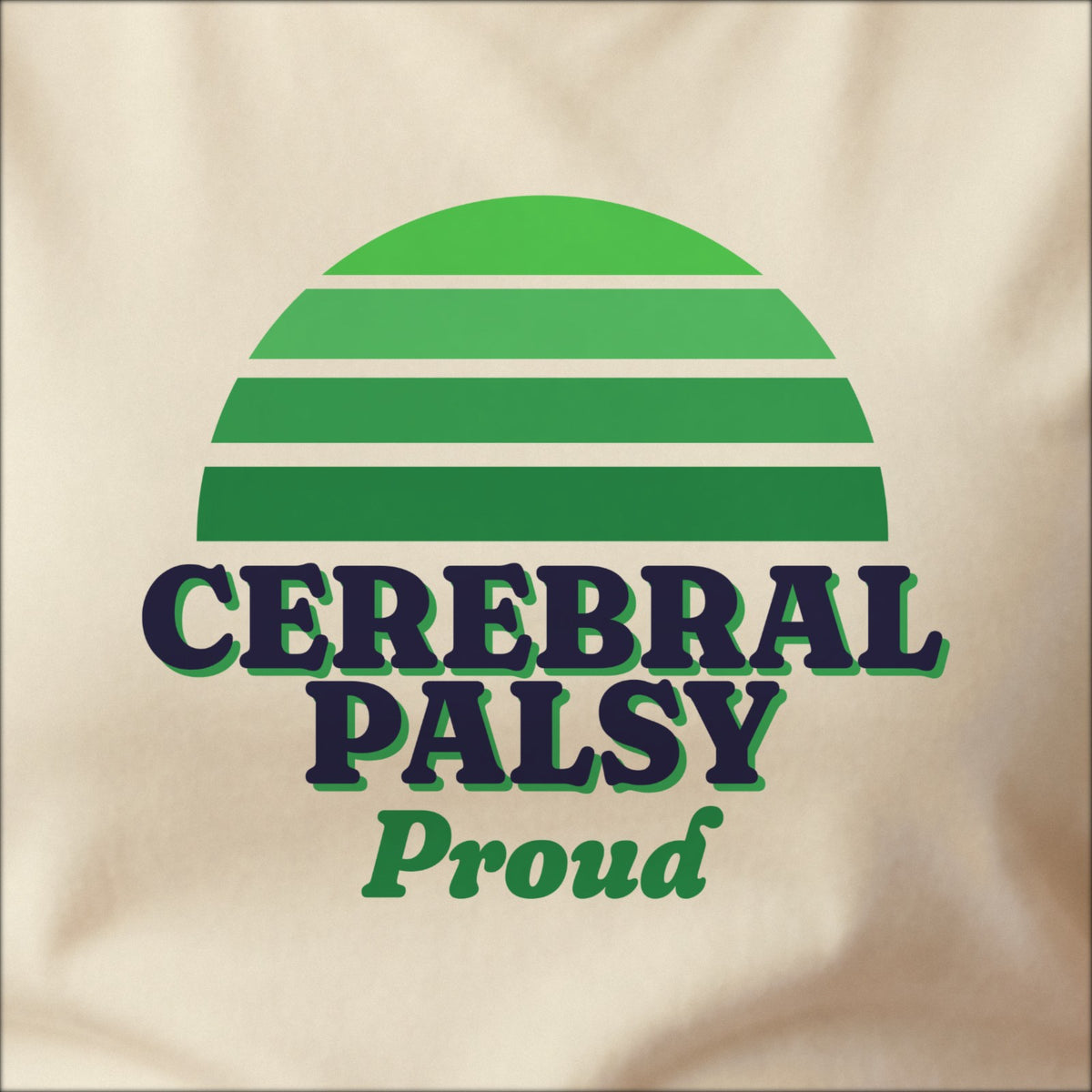 Close-up of the print on a natural tee: a striped half-sun in green above bold CEREBRAL PALSY lettering with “Proud” in script.