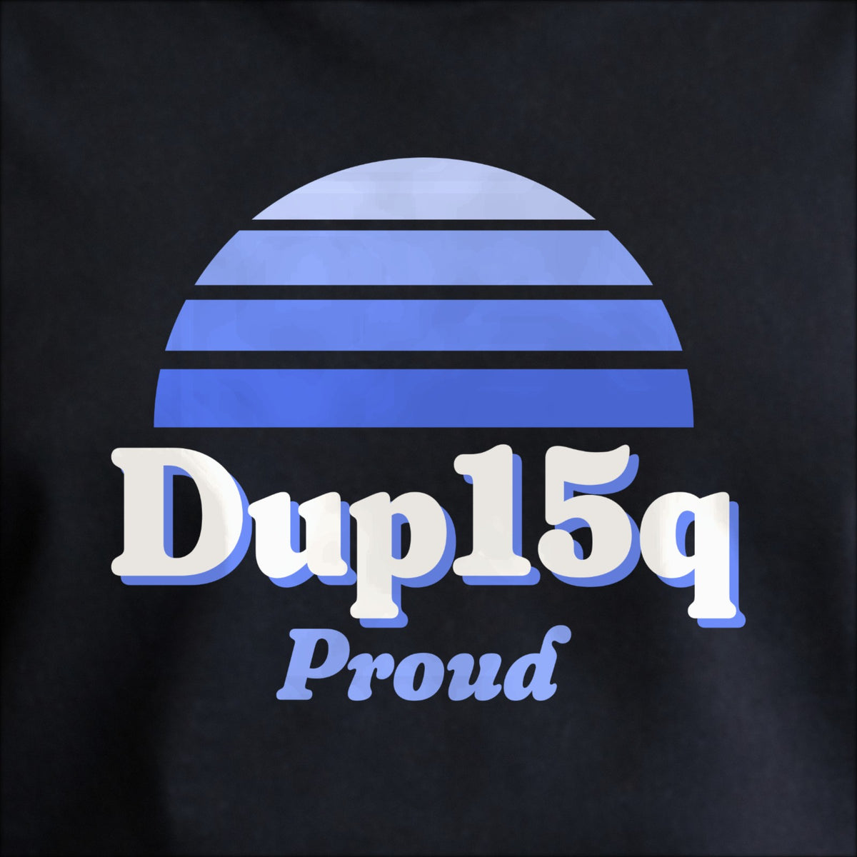 Close-up of the print on black: a striped half-sun in blue above cream DUP15q lettering with “Proud” in script.