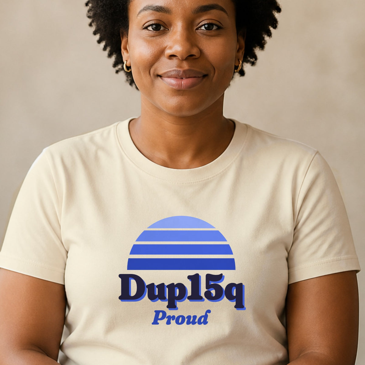 A woman wears a natural-colored Dup15q Proud tee with a blue striped retro sun.