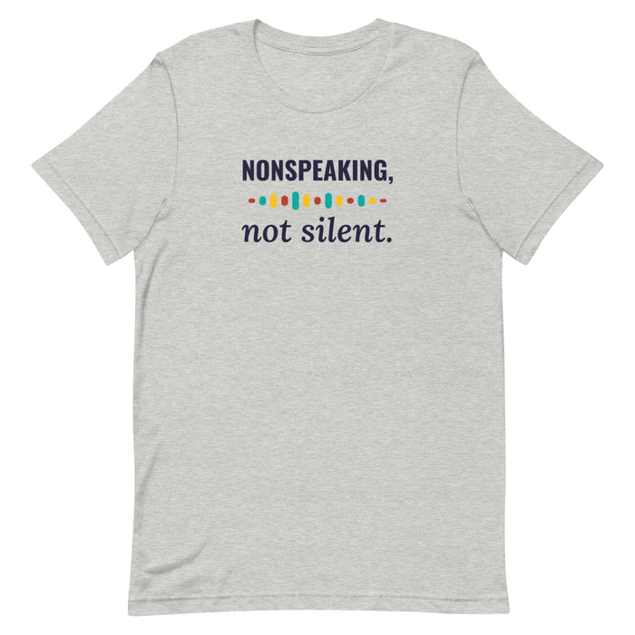 Heather gray adult tee laid flat, printed NONSPEAKING, not silent. with a row of colorful sound-wave dots
